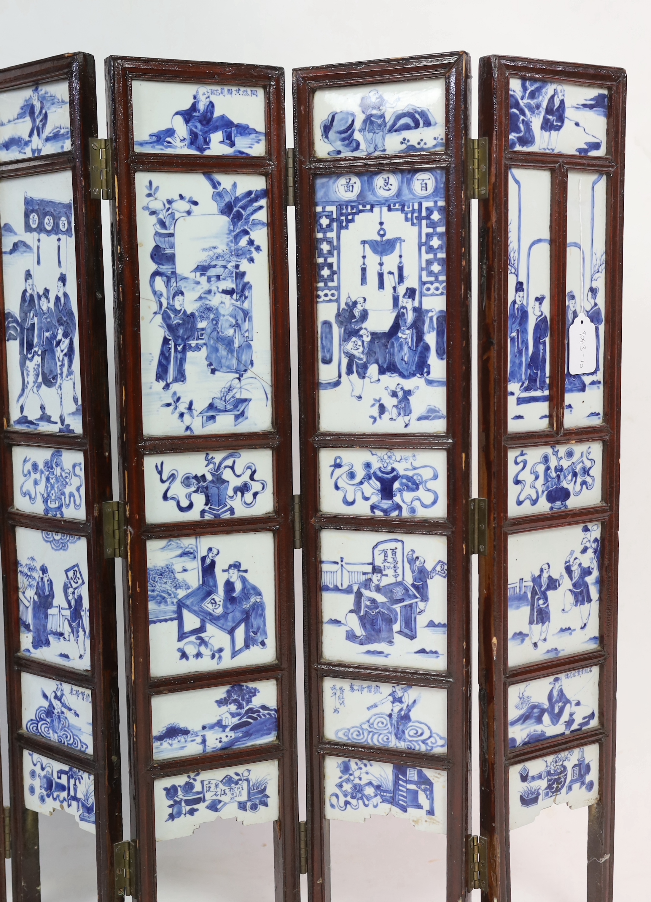 A Chinese blue and white panelled seven-fold low screen, late 19th/early 20th century, some cracked panels